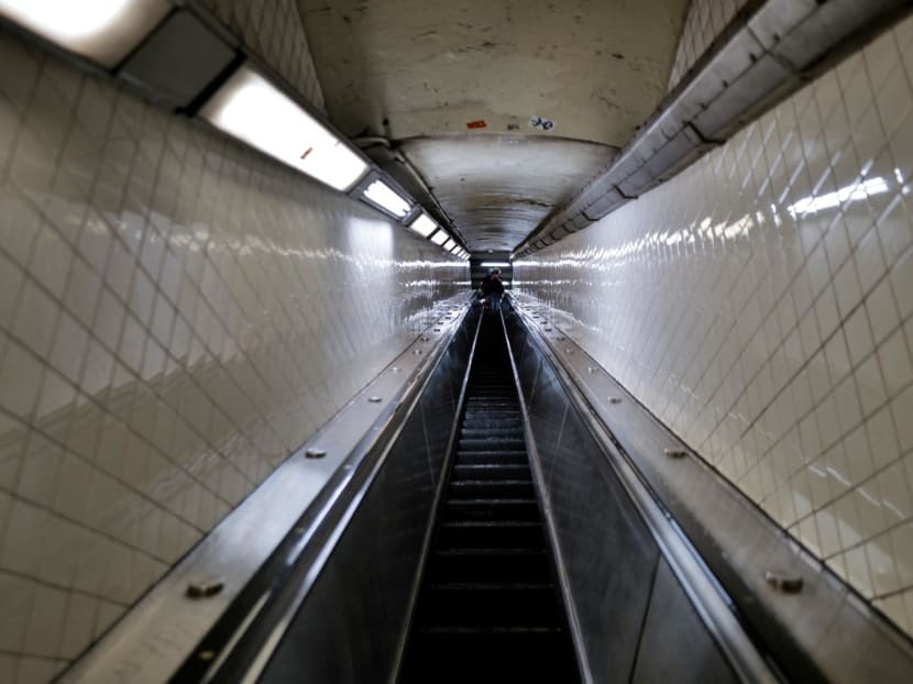 People use an escalator in a subway station of the Manhattan borough of New York on Jan 8, 2024.