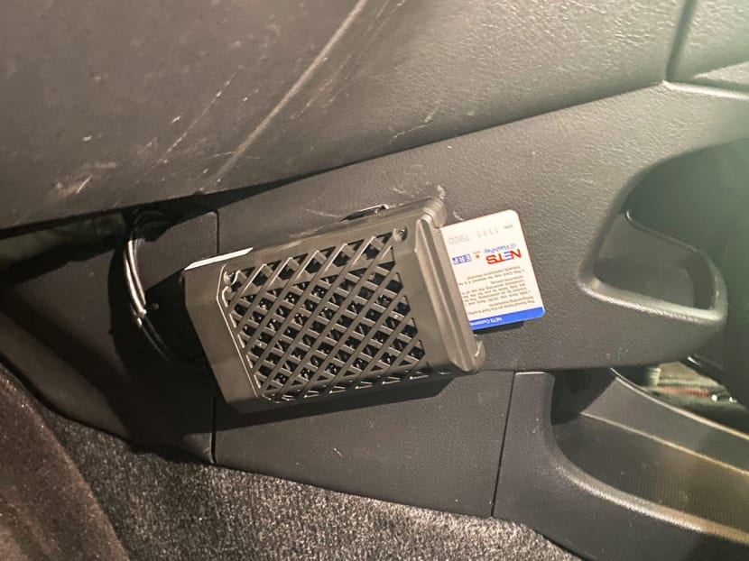 A new model of an in-vehicle unit that Singapore motorists have to install, where drivers can insert a payment card to pay for parking fees and road toll charges. A new model of an in-vehicle unit that Singapore motorists have to install, where drivers can insert a payment card to pay for parking fees and road toll charges.
