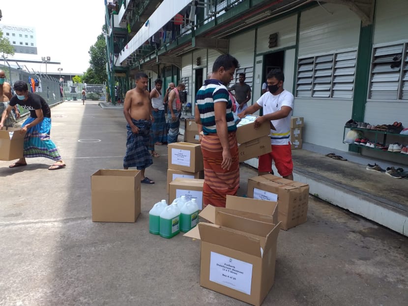 Donated hygiene supplies being distributed by foreign workers in Cochrane Lodge 2, a dormitory located in Admiralty.