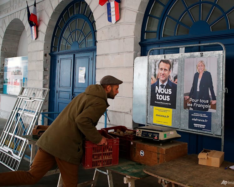 Voting opens in France runoff between Macron and Le Pen