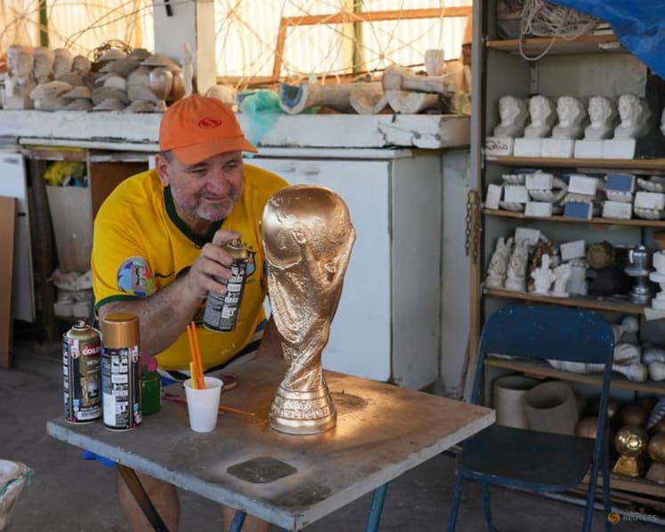 In Rio, artisan crafts World Cup trophies while hoping Brazil gets a real one