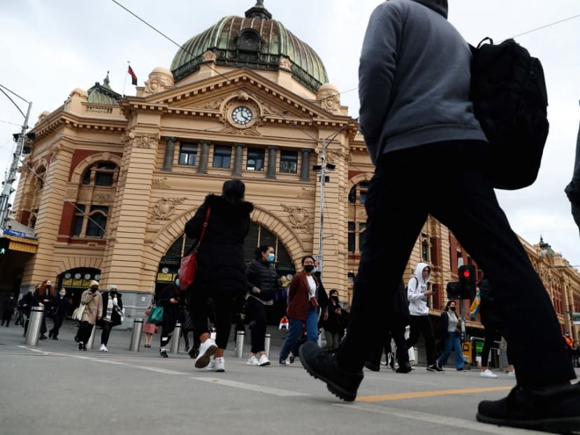 People walk outside Flinders Street Station in downtown Melbourne on Aug 5, 2021, as authorities there announced a sixth lockdown for the city in efforts to bring the Delta outbreak to heel. People walk outside Flinders Street Station in downtown Melbourne on Aug 5, 2021, as authorities there announced a sixth lockdown for the city in efforts to bring the Delta outbreak to heel.