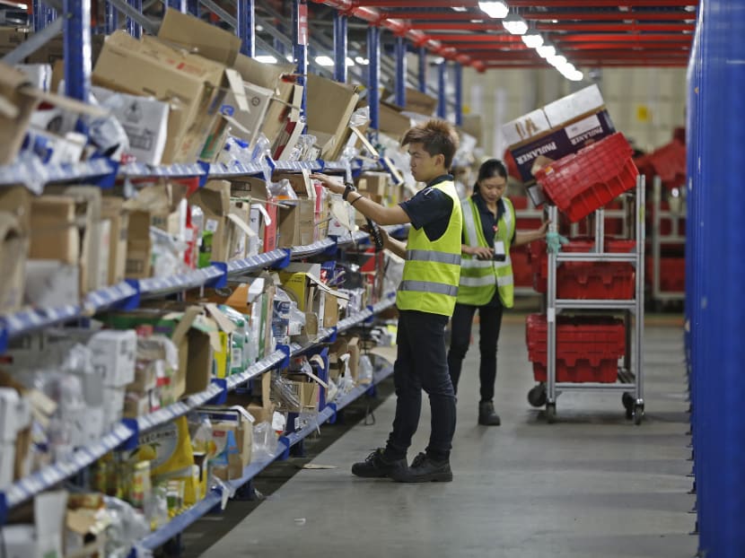 Pickers working at RedMart, for Job Series story on E-Commerce.