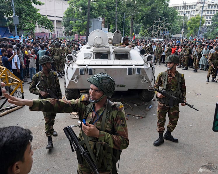 PHOTOS: Bangladesh protesters celebrate as prime minister resigns and flees abroad