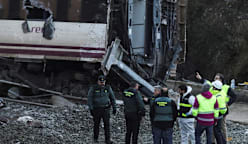 Spain deploys heavy machinery to find missing bodies among train crash wreckage