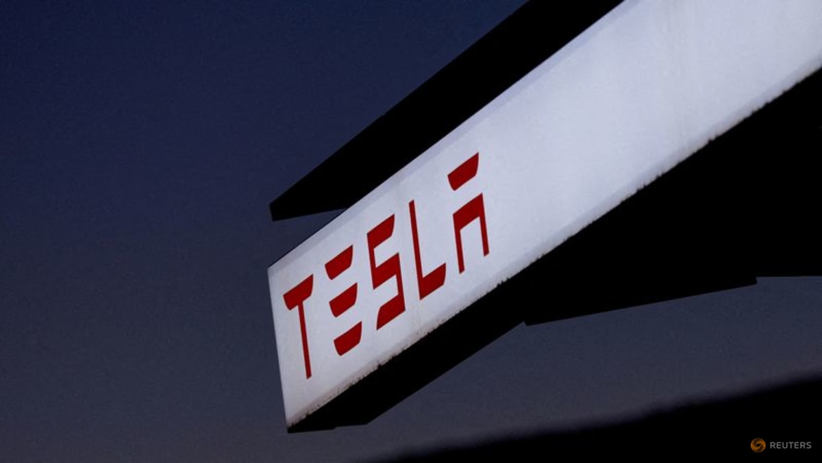 Three charged in arson attacks at Tesla dealerships, charging stations ...