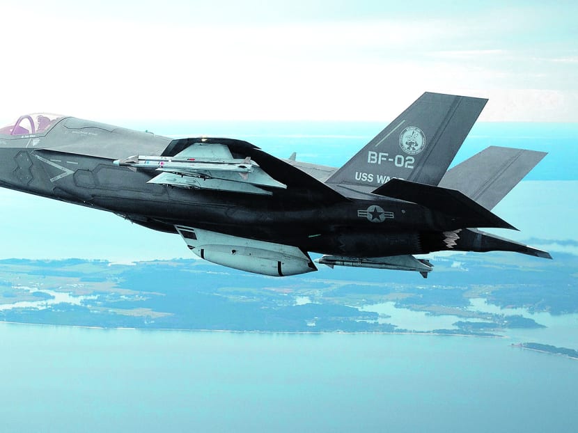 The U.S. Marine Corps version of Lockheed Martin's F35 Joint Strike Fighter, F-35B test aircraft BF-2 flies with external weapons for the first time over the Atlantic test range at Patuxent River Naval Air Systems Command in Maryland in a February 22, 2012 file photo. Photo via Reuters