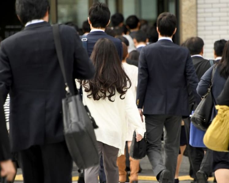 Commentary: Tokyo’s four-day work week offers limited relief for parents