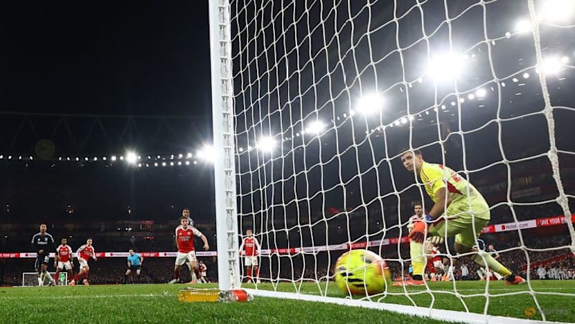 Arsenal halt Villa charge to stay clear in title race