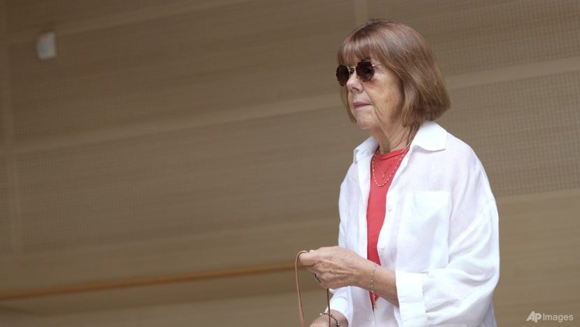 French woman whose husband is accused of inviting men to rape her testifies in court