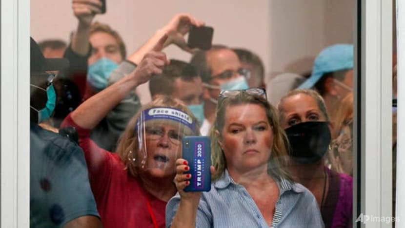 Trump backers converge on vote centres in Michigan, Arizona Trump backers converge on vote centres in Michigan, Arizona