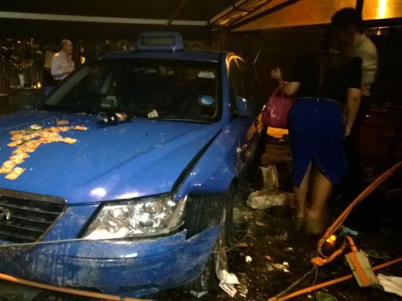 Taxi ploughs into outdoor area of bar along East Coast Road; 5 sent to hospital