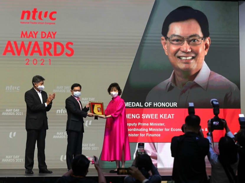 DPM Heng Swee Keat conferred the Medal of Honour at the NTUC May Day Awards 2021 ceremony on April 28, 2021. Presenting the award was NTUC president Mary Liew and NTUC secretary-general Ng Chee Meng. DPM Heng Swee Keat conferred the Medal of Honour at the NTUC May Day Awards 2021 ceremony on April 28, 2021. Presenting the award was NTUC president Mary Liew and NTUC secretary-general Ng Chee Meng.