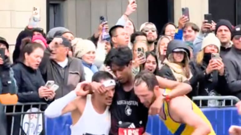 Boston marathon runners praised for giving up personal bests to help exhausted man finish