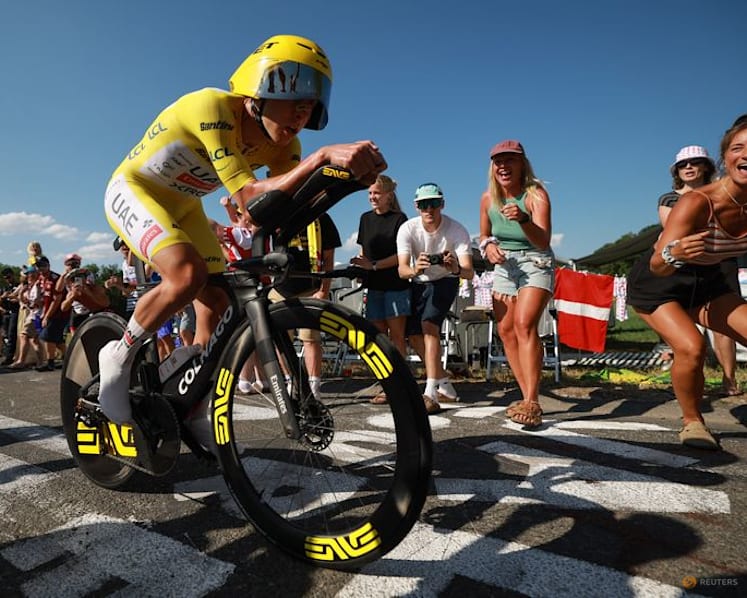 Evenepoel wins time trial to cut Pogacar's lead