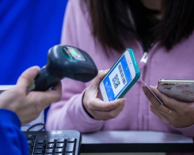 Tap, scan, donate: More social service organisations going cashless for fundraising