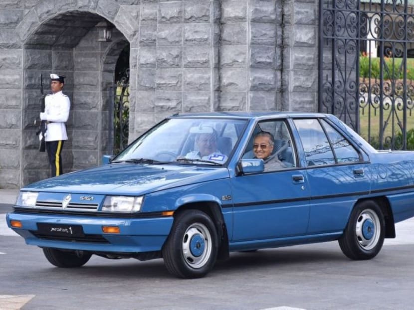 Sultan Ibrahim Sultan Iskandar of Johor and Prime Minister Dr Mahathir Mohamad in a blue Proton Saga. Sultan Ibrahim Sultan Iskandar of Johor and Prime Minister Dr Mahathir Mohamad in a blue Proton Saga.