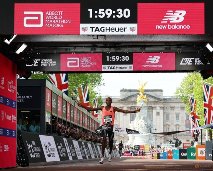 Kenya's Sawe becomes first man to run marathon under two hours at London Marathon