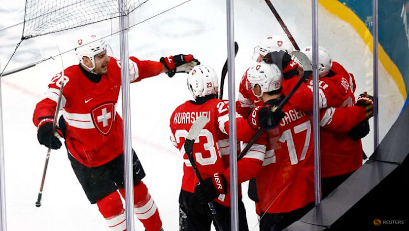 Ice hockey-Canada thrash France 10-2, Swiss top Czechs in OT, Denmark down Latvia