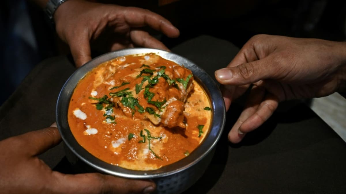 Food fight in Indian courts to decide who invented butter chicken - CNA