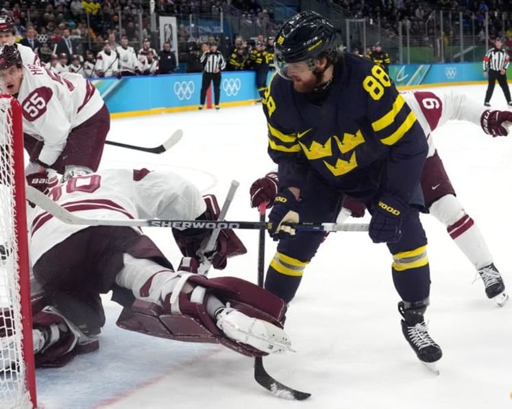 Ice hockey-Sweden beat Latvia to set men's quarter-final meeting with US