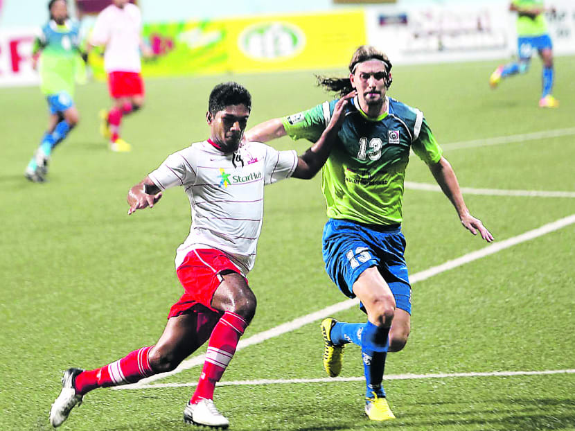 Hariss Harun (in white) will be playing for JDT I. TODAY file photo