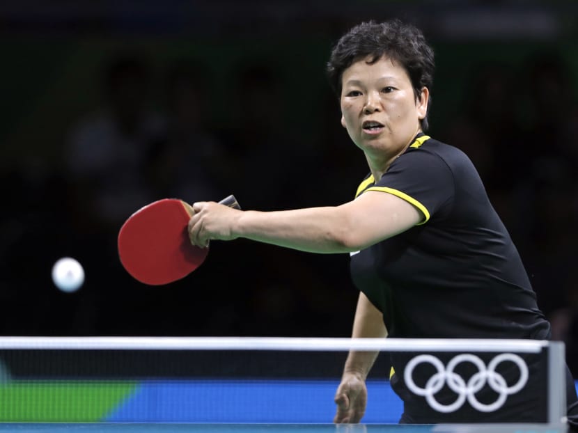 Ni Xia Lian, of Luxembourg, returns a shot to Caroline Kumahara, of Brazil, during their table tennis match at the 2016 Summer Olympics in Rio de Janeiro, Brazil, Saturday, Aug. 6, 2016. (AP Photo/Petros Giannakouris)