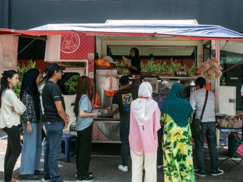 Customers buying their meals at a food truck in Petaling Jaya, Malaysia on Sept 19, 2023.