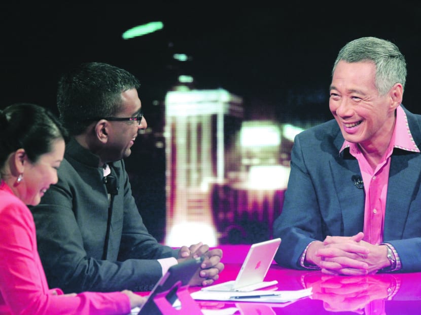 PM Lee Hsien Loong during a LIVE recording of Ask The Prime Minister with hosts CNA Presenter Sharon Tong (left) and Editor-in-Chief Walter Fernandez (right) at the MediaCorp TV theatre. Photo: Don Wong