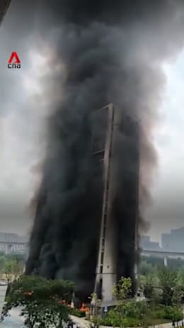 Fire at Hangzhou electric bike parking lot engulfs high-rise in smoke