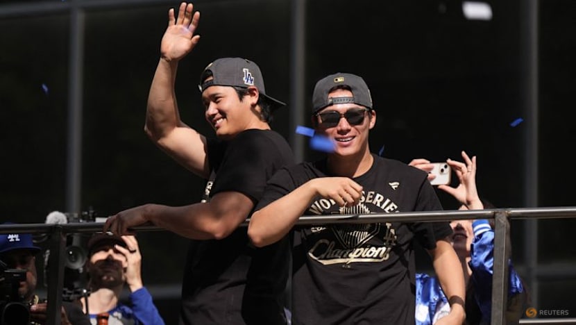 Baseball-Ohtani teases 'three-peat' as Dodgers parade draws Los Angeles crowds