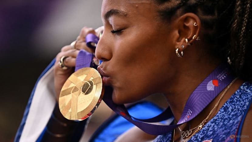 Davis-Woodhall adds world long jump title to Olympic crown