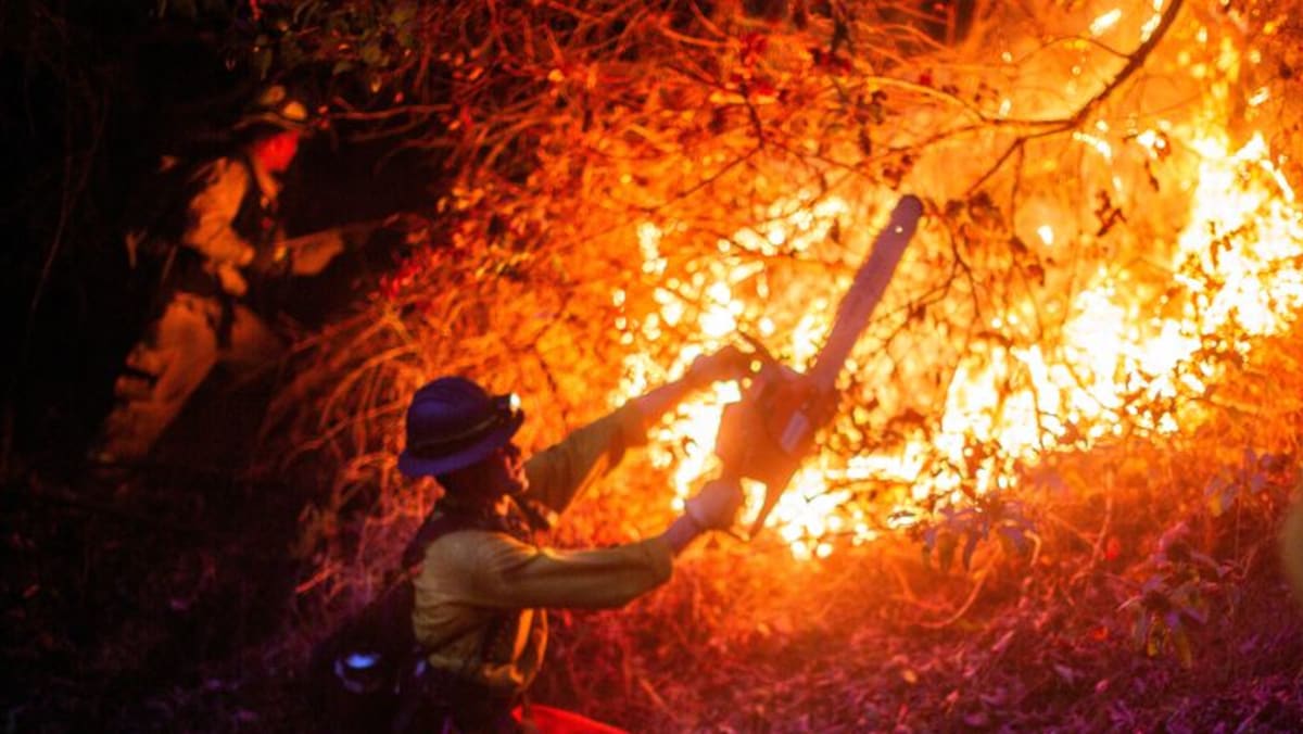 Death toll from Los Angeles fires rises, with dangerous winds incoming