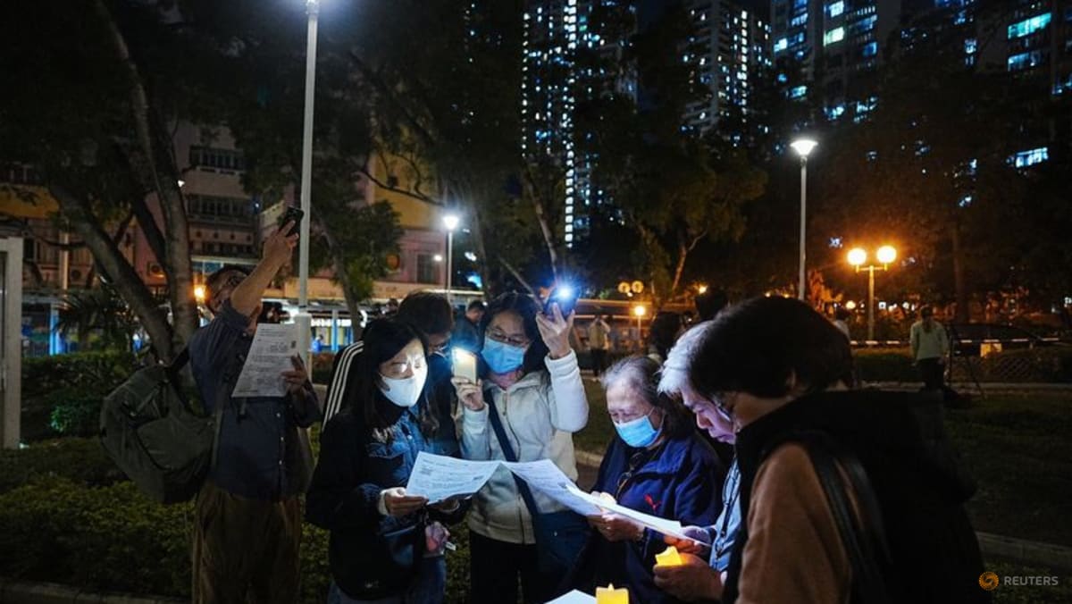 Hong Kong mourns victims of blaze that killed 128 and counting