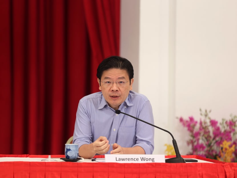 Finance Minister Lawrence Wong speaking during the press conference at the Istana on April 16.