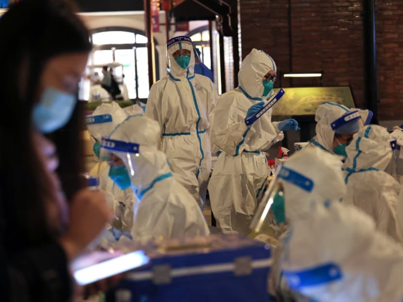 This photo taken on Oct 31, 2021 shows medical personnel preparing to test visitors for the Covid-19 coronavirus at Disneyland in Shanghai after a single coronavirus case was detected at the park on the weekend. This photo taken on Oct 31, 2021 shows medical personnel preparing to test visitors for the Covid-19 coronavirus at Disneyland in Shanghai after a single coronavirus case was detected at the park on the weekend.