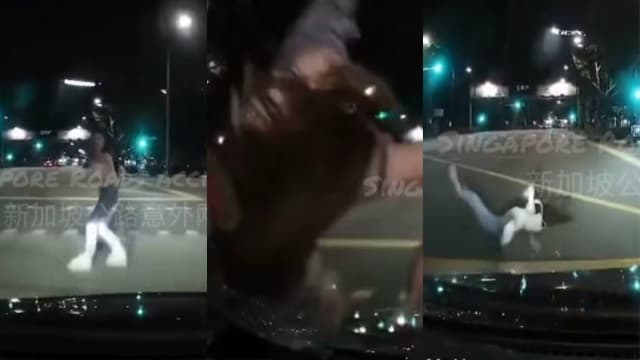 疑顾滑手机没看交通灯 女子过马路遭撞飞数米外