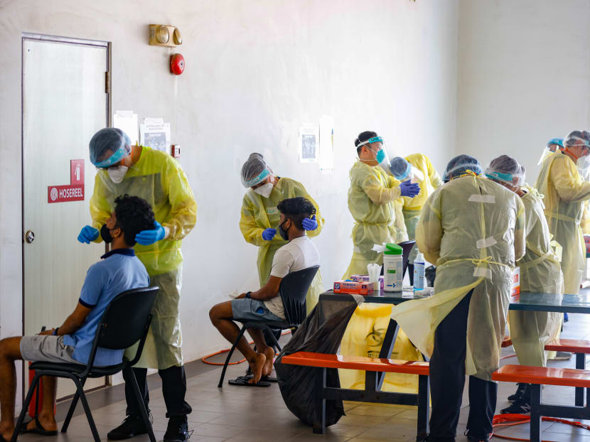 Foreign workers undergoing the antigen rapid test.