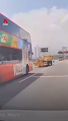 At least 24 injured after Hong Kong bus crashes into highway maintenance truck