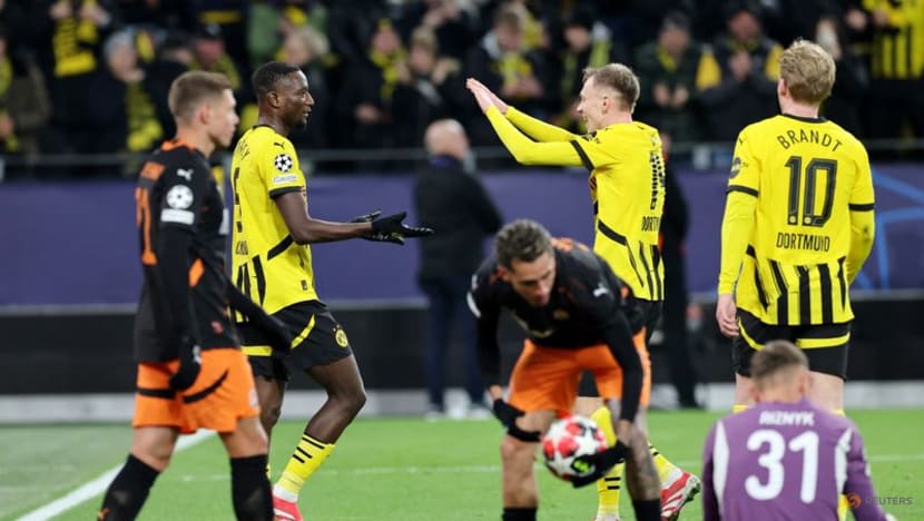 Dortmund beat Shakhtar Donetsk 3-1 to reach Champions League knockout play-offs Dortmund beat Shakhtar Donetsk 3-1 to reach Champions League knockout play-offs