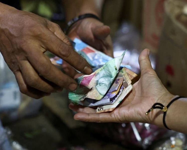 Indonesian central bank says governor briefs foreign investors following surprise rate hike