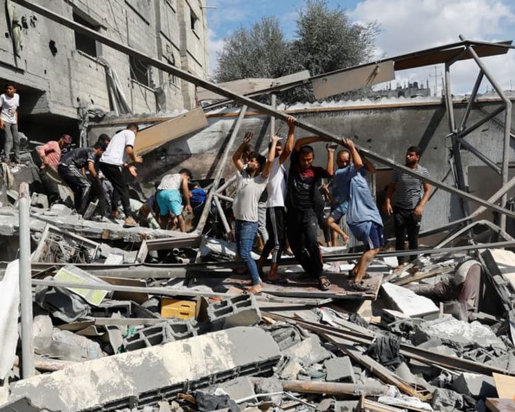 Palestinian medics in Gaza rush to save lives as Israeli airstrikes continue