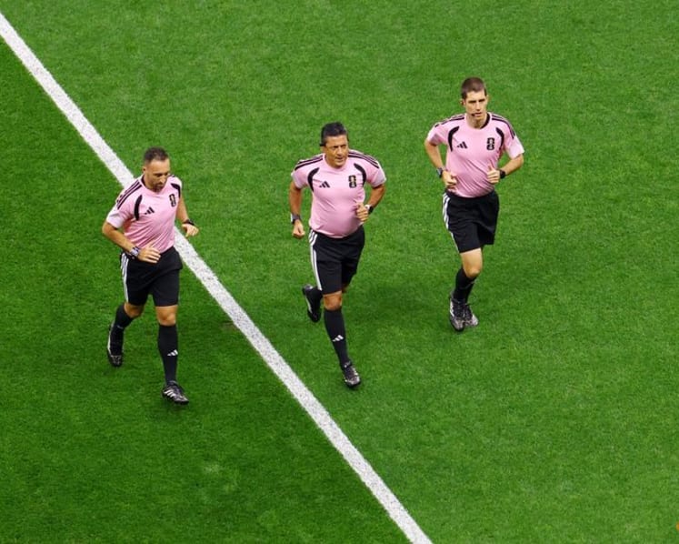 The World Cup's hidden runners: referees keep pace with players and pressure