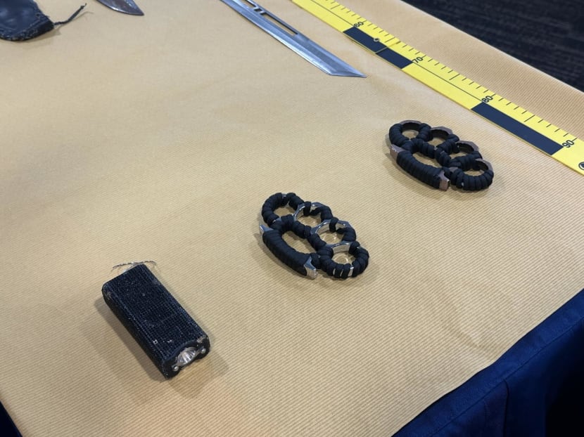 Various weapons in possession of the man, including two knuckledusters and a stun gun.