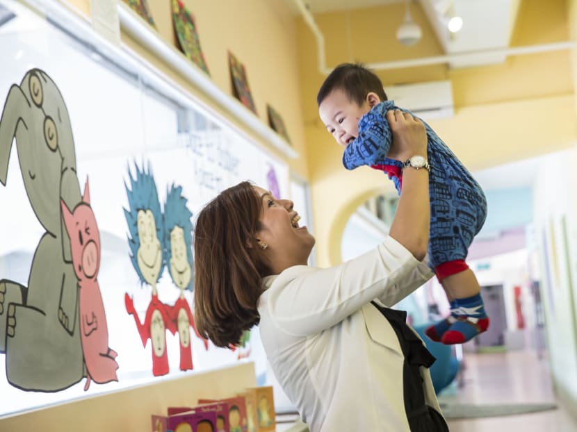 Mrs Kimberlyn Tan, 30, with her 8-month old son Denzel, at his infant care centre. Mrs Tan is just one of a growing number of parents who have placed their children at infant care centres Photo: Nuria Ling/TODAY