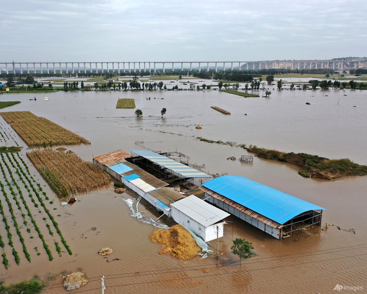 Bus plunge, floods leave at least 28 dead in northern China