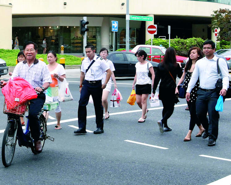 Using mobile phones while crossing roads not an offence: Police