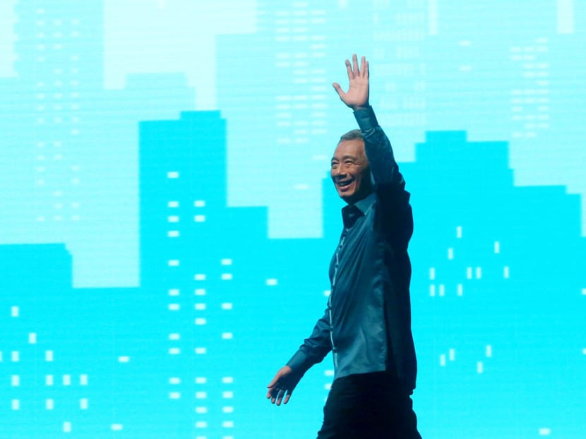 Prime Minister Lee Hsien Loong waves at the start of the National Day Rally.
