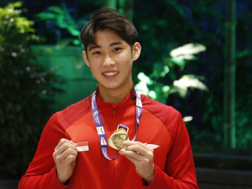 Singapore’s badminton world champion Loh Kean Yew arriving at Changi Airport on Dec 21, 2021. 