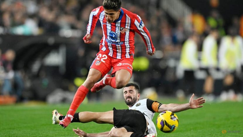 Atletico claim provisional top spot with 3-0 win at Valencia